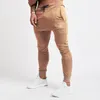 Pantaloni maschili di alta qualità sik seta di seta poliestere poliestere fitness casual addestramento quotidiano sport jogging
