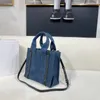 Sacs à main de créateurs Sac fourre-tout Woody Sac décontracté moyen Mode féminineLe sac fourre-tout Sac de voyage à poignée supérieure Sacs à bandoulière en lin Sacs en denim bleu en toile de haute qualité