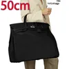 Sac fourre-tout Hommes Hanbags 50cm Sacs à main Sacs de créateurs personnalisés Sac en édition limitée Grande capacité de voyage en cuir dominateur hommes ont logo FN35