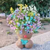 Dekorative Blumen Blumengraskopf Puppe für Gartenverzierungen
