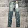 Jeans da uomo viola Pantaloni con foro blu di marca di moda lavati con inchiostro spruzzato