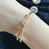 Bangle European Rose Gold Rope Knot Armband Women's High-End mode lyxmärke Högkvalitativ smycken Party Gift 230814