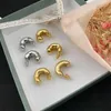 Studörhängen temperament avancerad personlig mässing guldpläterad halvmåne formad för kvinnors tjej gåva exklusiva smycken grossist