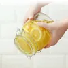 Opslagflessen roestvrijstalen gesp glazen blikje fles met deksel voedsel honingmoeren en korrels afgesloten