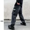 Jeans man maschile streetwear hip hop pantaloni di carota retrò per uomini lettere riflettenti tasca