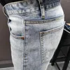 Jeans masculinos Japanese e estilo coreano Autumn Fashion Brand casual zíper azul costura de moto calças empilhadas masculinas slim