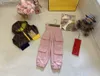 Kinderkleding kinderen lente roze casual lading broek baby herfst bodems modezijde multi pocket decoratie broek 26 juli 26
