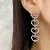 Новая разработанная мода 925 Silver Hollow Out Full Diamonds Серьги для кисточки Titanium Steel Love Ears Дизайнерские ювелирные изделия T0818