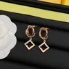 Vrouwen stijlvolle oorbellen ontwerper 18k goud vergulde cirkel rhombus holle diamanten sprankelende gepersonaliseerde bungelende heuvels trendy eenvoudige feestjuwelen