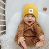 M609 Yeni Sonbahar Kış Bebek Bebek Çocuklar Örme Şapka Gülümseme Desen Çocuk Kafatası Beanes Caps Sıcak Yün Şapkalar