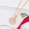 Fashion Bvlgr jewelry brand designer women's accessories Yuanbao Copper Coin Necklace Women's Fashion Simple Hollow Full Diamond S925 Sterling Silver Collar Chain