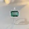 PANSYSEN Luksusowe najwyższej jakości szmaragdowe pierścionki dla kobiet Pierścień zaręczynowy ślub 100% 925 Srebrny dar biżuterii J1208