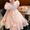 Robes de fille Robe de fille à la mode pour enfants manches à bulles robe de princesse à fleurs fragmentées été nouvelle robe rouge nette pour petites filles