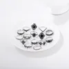 Anelli di cluster Delysia King 15pcs/Set Fashion Hollow Lotus Lotus da 15 pezzi Black Gem Set Ring