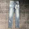 2023 Nya lila jeansdesigner Fashion Men's and Women's Purple Brand Pants Retro Street Sports Pants Slim Slim Denim tårar tvättar gamla jogging byxor långt hål rakt