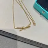 Collier de nœud doré de marque de concepteur de haute qualité CNC Set Semi Diamond Smooth Asymétrique 18K Chaîne en or rose avec logo
