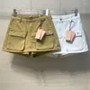 女性のショートパンツ高品質2023夏のトレンドポケットワーキング服2色の汎用性のあるウエストデニム