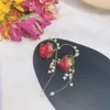 Kolczyki Dangle Flower Flower Pearl wysuszony ręcznie robiony niszowy projekt prawdziwy płatek długi prezent