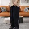 Pantaloni maschili di colore solido uomo pantaloni streetwear cargo sciolto in forma multipla design elastico in vita elegante