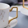 Mokken Wourmth 12 Constellations Coffee Cup Saucer Wit en Gold Bone China Porseleinen theekopjes met roestvrijstalen lepel Zodiac Cup 230818