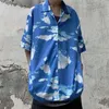 メンズカジュアルシャツ2023衣類ニュートラルヒップスターボタン半袖ハンサムルーズ印刷ファッショナブルなストリートウェアサマーシン