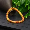 Strand 2023 Fashion Charms Accessories Yellow Beeswax Imitation Ambers Beads Armband Pärlade Elastiska armband unisex smycken gåva