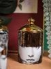 Candlers Luxury Gold Ceramic Storage Jar Face Abstract Face Bodile Boîte à coton Cotton Boîte de bijoux avec un récipient de rangement de cuisine au couvercle 230817