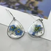 Boucles d'oreilles étalon rétro ovales transparentes naturelles à fleurs sèches résine contracte de la résine originale des femmes bijoux pour femmes