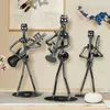 Decorative Objects Figurines 8pcs Musician Guitar Player Metal Statue Musical Instrument Iron Art Collectible Figurine Home Cafe Office Book 230817