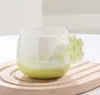 La dernière tasse à café en céramique de fleur de cerisier de 12 oz, de nombreux choix de styles, prend en charge la personnalisation de n'importe quel logo