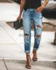 Jeans feminino 2022 Novas mulheres moda no meio do namorado Big Ripped Hole Hole High Street calça jeans sexy lápis vintage jeans J230818