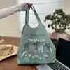 Totes Casual grote capaciteit Tote -tassen voor vrouwelijke handtassen en portemonnees luxe ontwerper 2023 Nieuw in denim borduurbrieven Tassel doek hkd230818