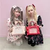 Kosmetiska väskor fall japansk stil ruffled pärlbåge bärbar axel messenger väska söt och söta kvinnor flickor läder handväskor 230817