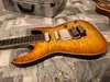 Pensa Mark Knopfler MK-I Amber Quilted Maple Top elektrische gitaar Witte pickups, Floyd Rose Tremolobrug borgmoer, Gouden hardware