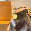 Designer tas, knoedelzak, handtas, schoudertas, crossbody tas, gemaakt van vintage stof, gecombineerd met luxe gele lederen bekleding, klassiek en tijdloos