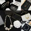 Pendant Necklaces Luxury Designer Letter Pendant Necklaces Gold Plated Crystal Pearl Rhinestone Necklace Women Jewerlry Fashion Pearl long Sweater chain Z230819