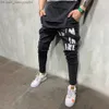 Мужские брюки High Street Men's Loose Trend Street Hip Hop Dark Y2K Инструмент граффити темный винтажный эластичный подвеска Z230819