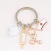 Key Rings Fashion Nurse Hat Stethoscope Syringe Mask Alloy Keychain Medical Tool Pendant Student Gift Souvenir Drop Delivery Smt0K