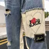 Męskie spodnie Y2K American Street Spllice Contrast Kolor otwarty przednie dżinsy męskie marka mody niszowa smażona ulica Hip Hop Design Pants Z230819
