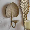 ろうそくのホルダーは、金の葉の壁の輪型のヴィンテージルームの装飾品を分類しました