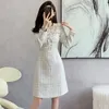 Casual jurken Kleine geurige geruite lange mouw Plaid Tweed Dress 2023 Herfst Winter O nek kralen Tassel Dikke wollen gesplitste vestidos voor vrouwen