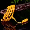 Perles de cire d'abeille jaune brin en huile de poulet minérale brute 108 colliers vieux bracelet d'ambre suspendu au cou