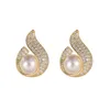 Nouvelles boucles d'oreilles en forme de flamme de perles incrustées de zircon avec des boucles d'oreilles de luxe légères à sens avancé Boucles d'oreilles de style petit parfum pour femmes à la mode Aiguille en argent