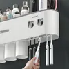 Toothbrush Holders IZEFS Magnetic Adsorption Inverted Toothbrush Holder Double Automatic Toothpaste Dispenser Storage Rack Bathroom Accessories Set 230820