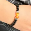 Strand svart lava sten lotus charm naturliga runda pärlor armband för män kvinnor elastiska armband handgjorda smycken