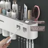 Toothbrush Holders IZEFS Magnetic Adsorption Inverted Toothbrush Holder Double Automatic Toothpaste Dispenser Storage Rack Bathroom Accessories Set 230820