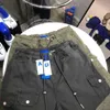 Ader Mens Pants Streetwear Hip Hop مطبوع بنطلون غير رسمي على الجعوب متعددة الجيوب المستقيمة زر الزواج الفضفاض