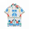 Chemises décontractées Summer Designer Hommes Femmes Hawaii Style Bouton Revers Cardigan À Manches Courtes Surdimensionné Chemise Blouses M-3XL