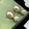 2023 Nouvelle mode perle pendentif boucles d'oreilles Charme aretes orecchini Résine laiton luxe designer boucle d'oreille pour les bijoux de cadeau de fête de mariage des femmes de haute qualité avec boîte