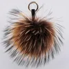 سلاسل مفاتيح مفتاح الفراء الفاخرة سلاسل مفتاح الفراء الحقيقي Pompom keychain 15cm Fluffy Raccoon Ball Gold Pompon Keyring Charm Bag Hights Pendant